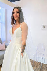 Glamorous A-Line Spaghetti Straps Sweetheart Satin Backless Beach Wedding Dress With Pockets